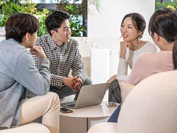 A photo of several people discussing